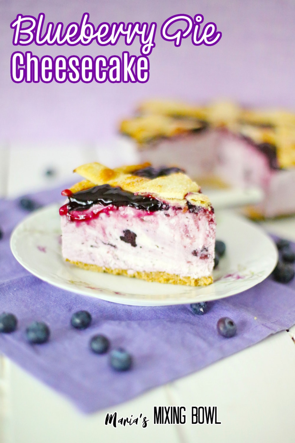 slice of blueberry pie cheesecake on a white plate