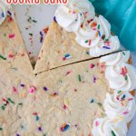 funfetti cookie cake with a slice misisng
