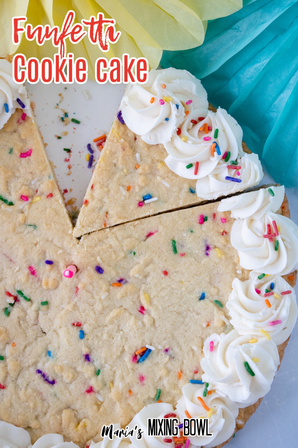 funfetti cookie cake with a slice misisng