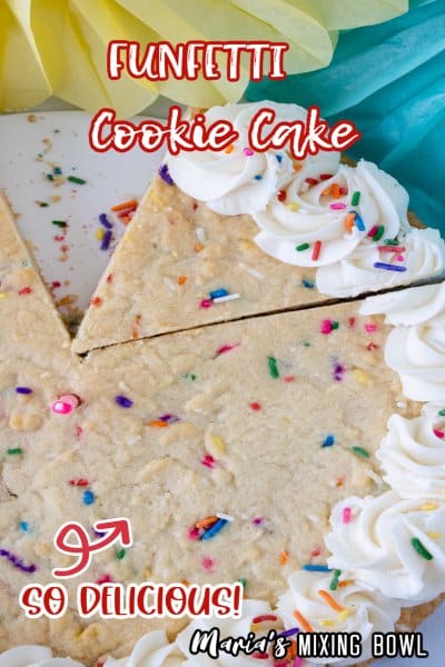 funfetti cookie cake with a slice missing