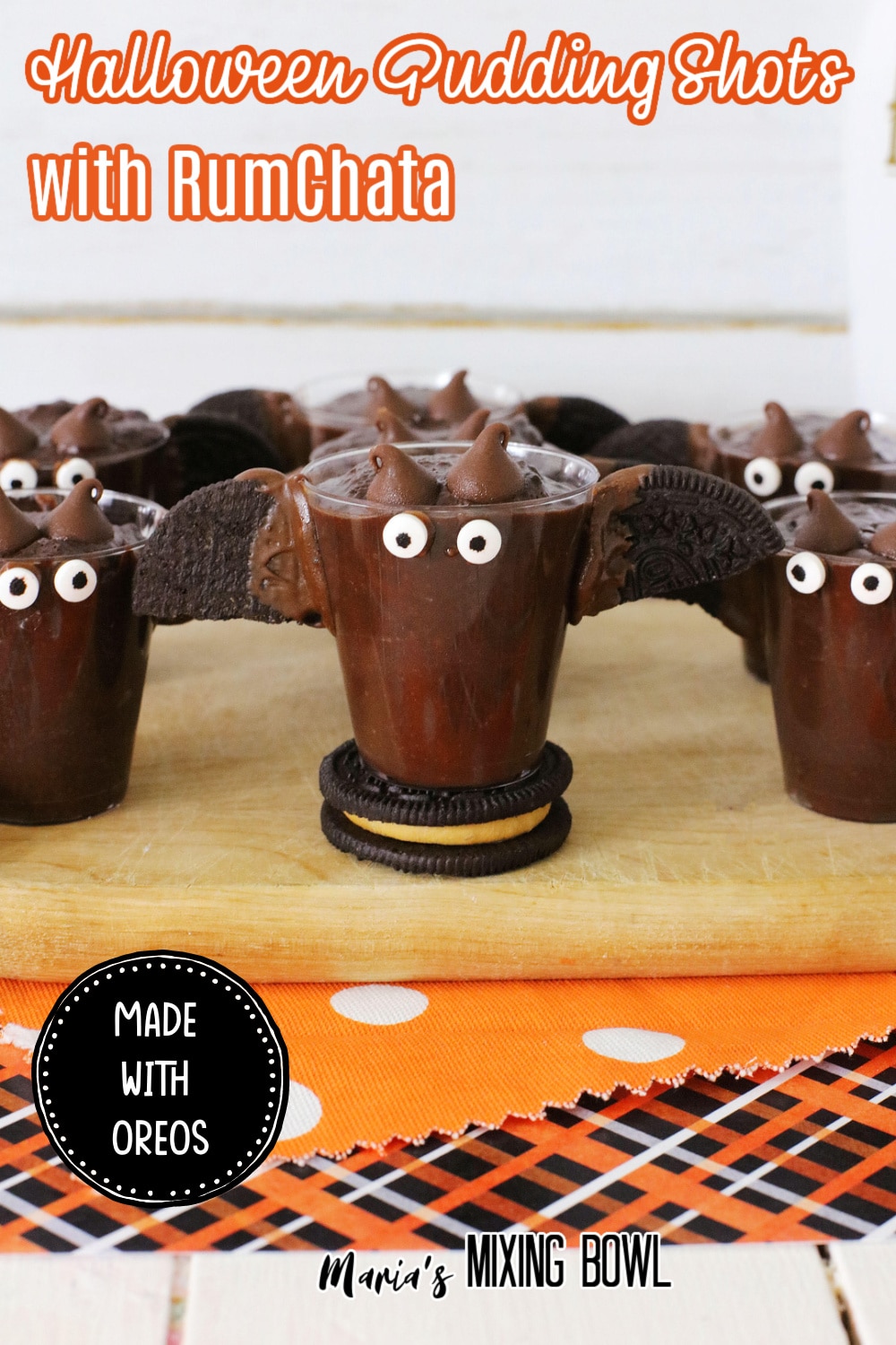Halloween Pudding Shots with Rumchata on a wooden board