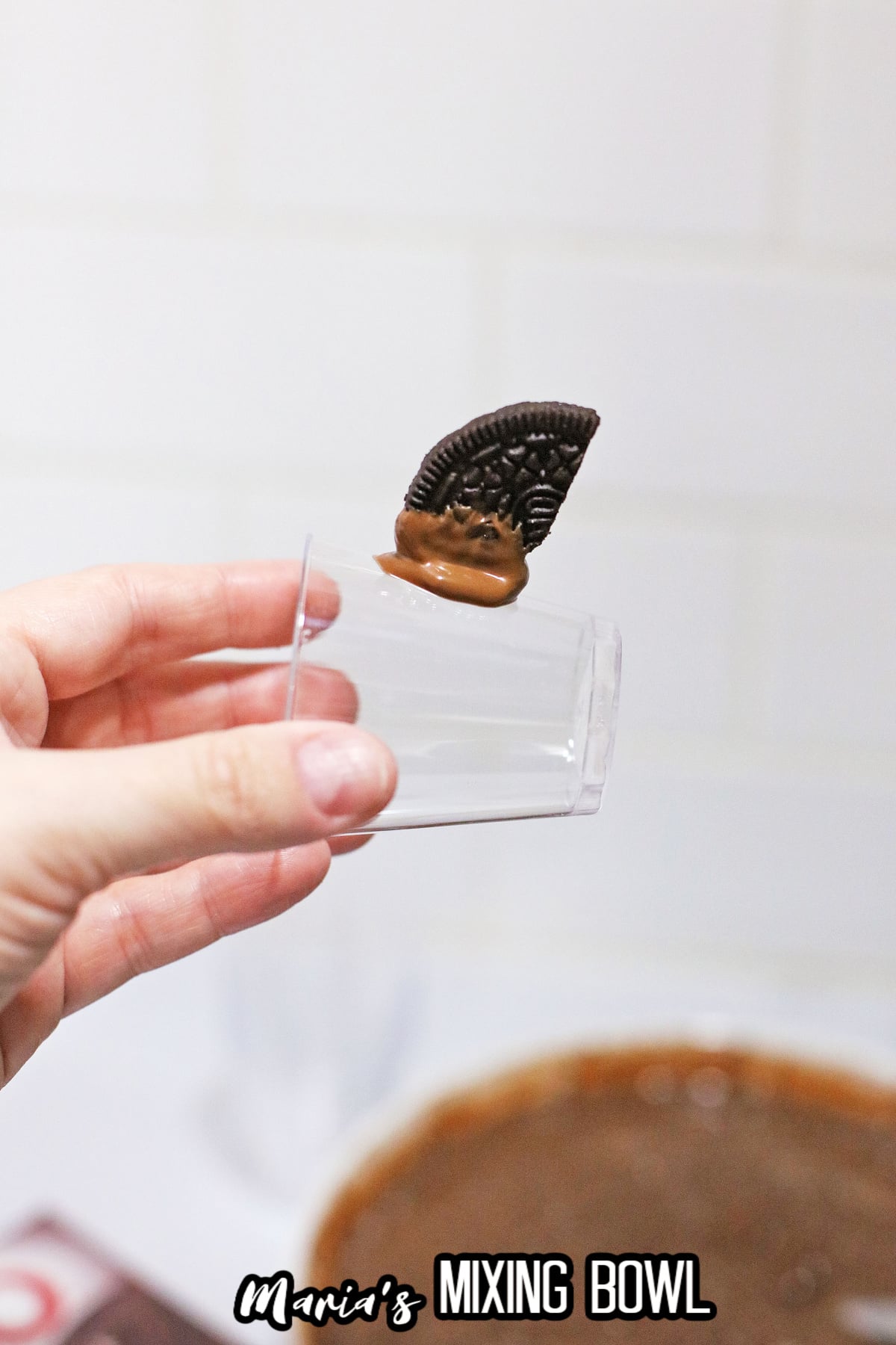 Halloween Pudding Shots with an Oreo stuck on cup
