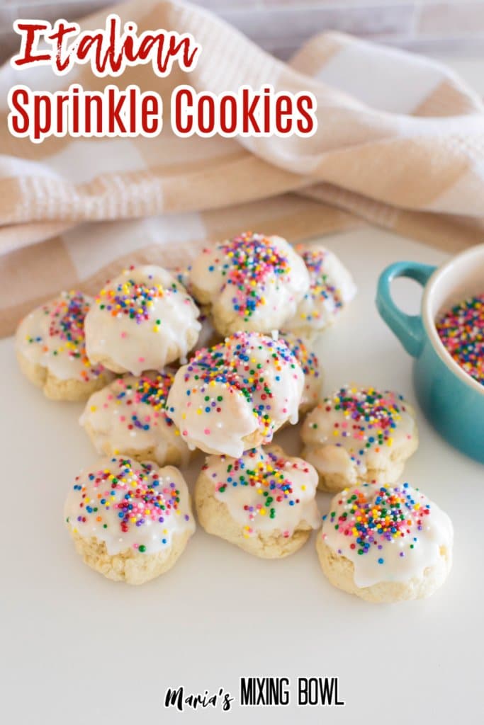 Italian Sprinkle Cookies stacked on a white table