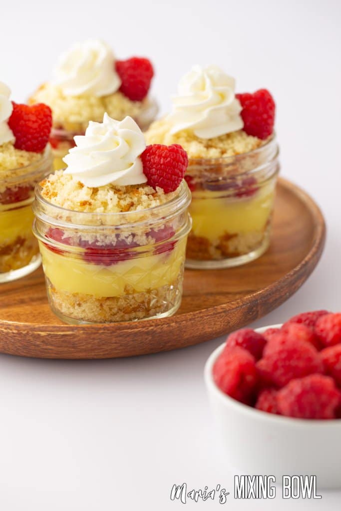 close up of lemon mason jar trifles on a wooden lazy susan