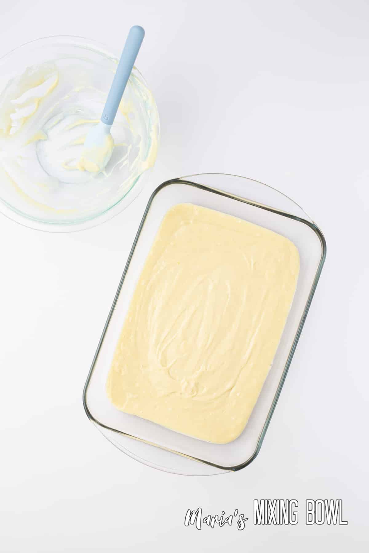 cake batter in a glass baking dish