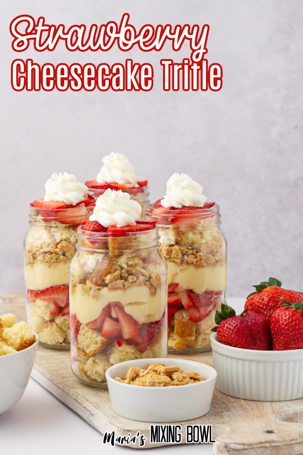 four strawberry cheesecake trifles glass jars