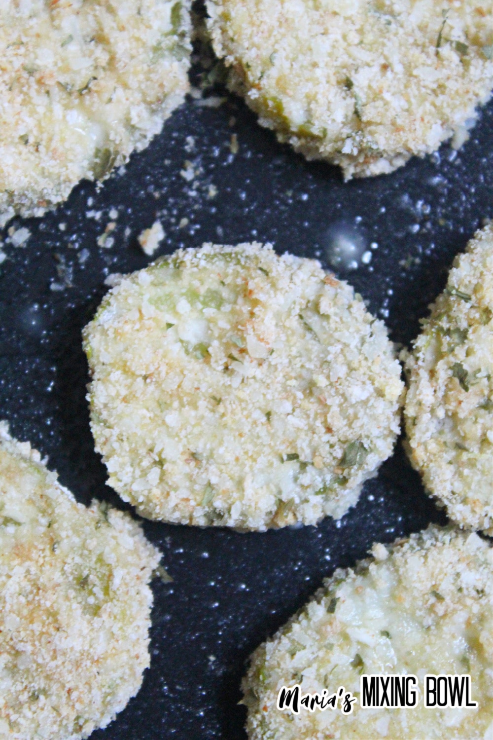 breaded cucumber slice waiting to be air fried
