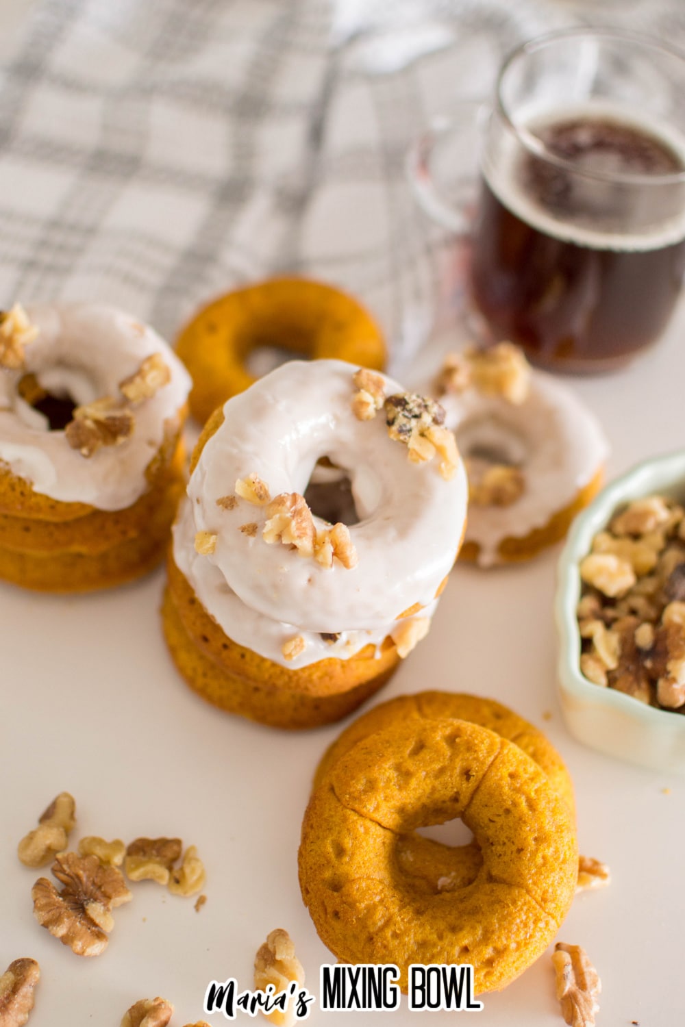 stack of baked pumpkin donuts on a white table
