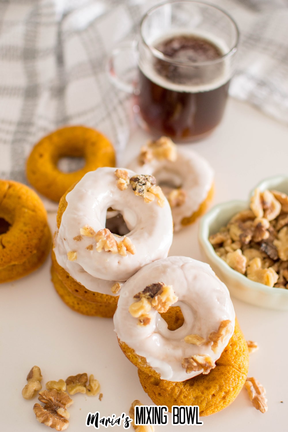 stack of baked pumpkin donuts on a white background