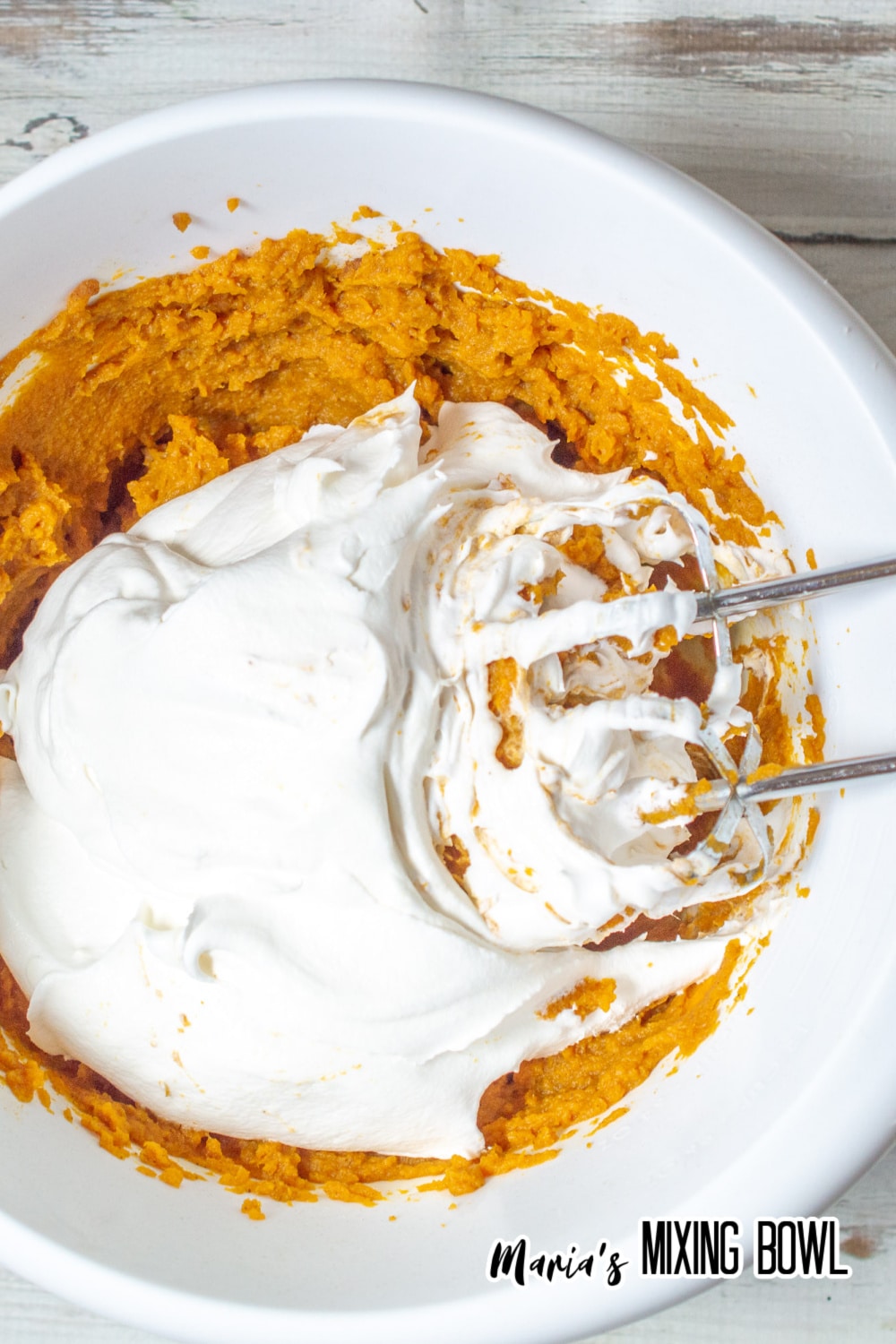 whipped topping being adding to pudding
