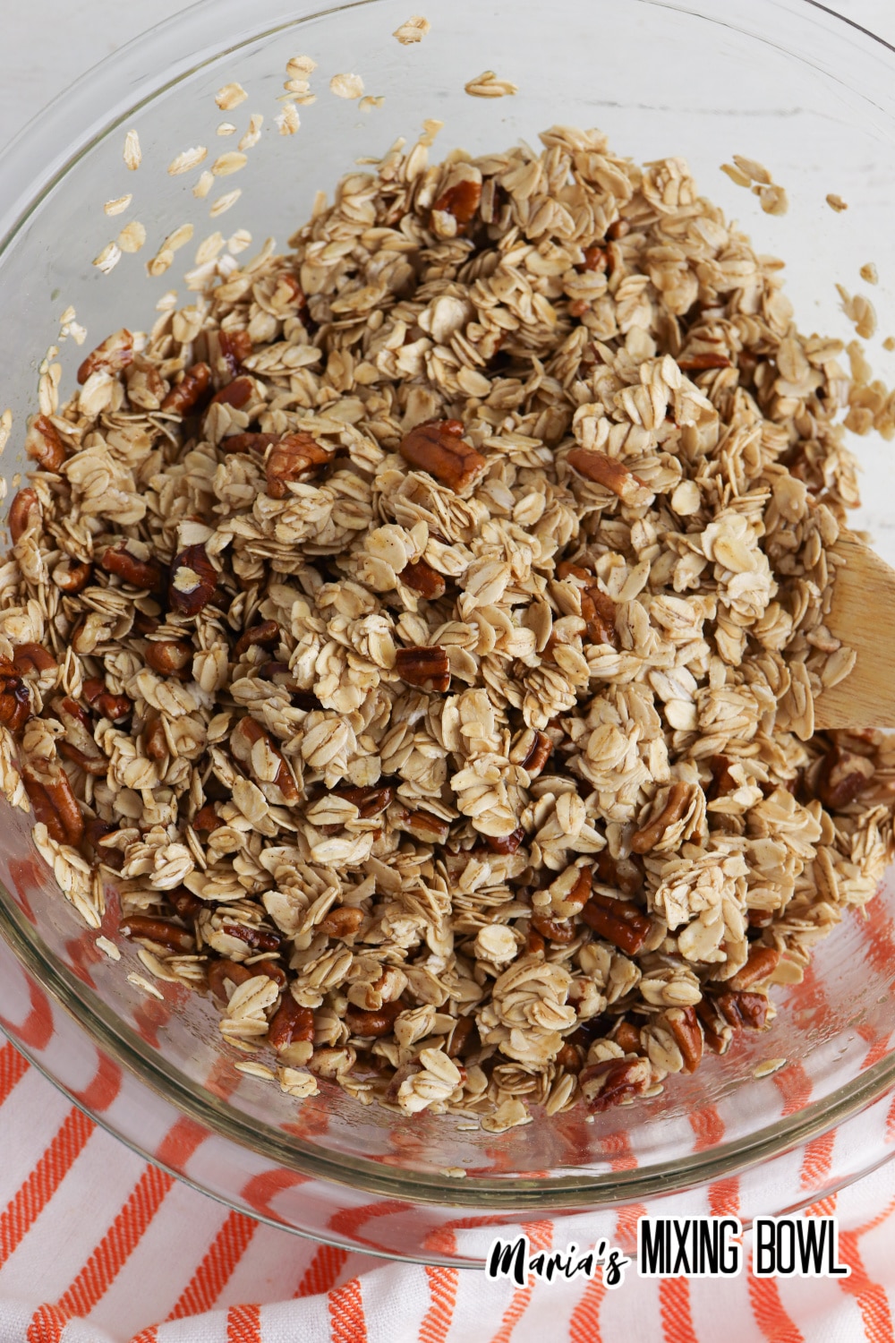 granola in a glass mixing bowl