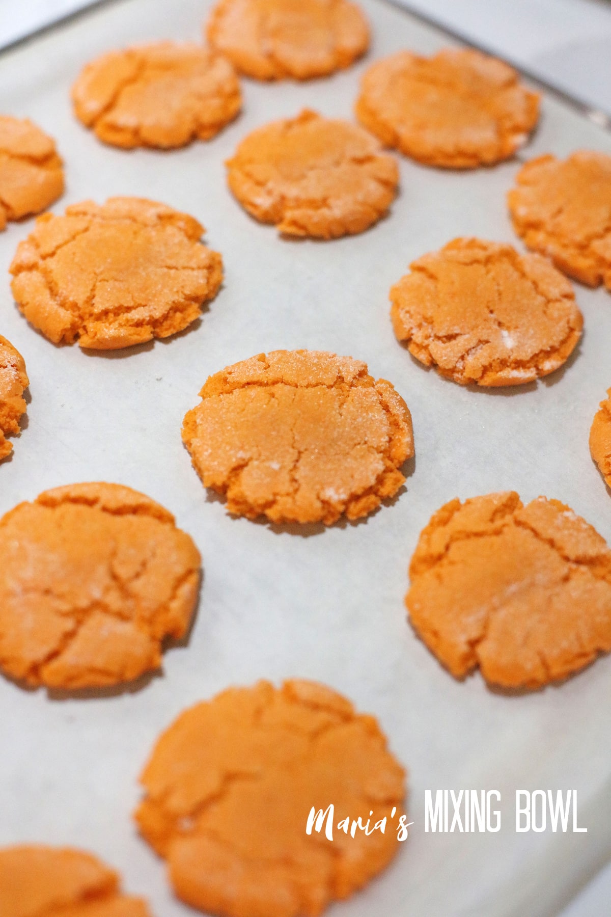 baked cookies on a parchment lined baking sheet