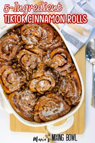 tiktok cinnamon rolls in a white baking dish with the name in text
