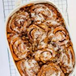 tiktok cinnamon rolls cooling on a wire baking rack