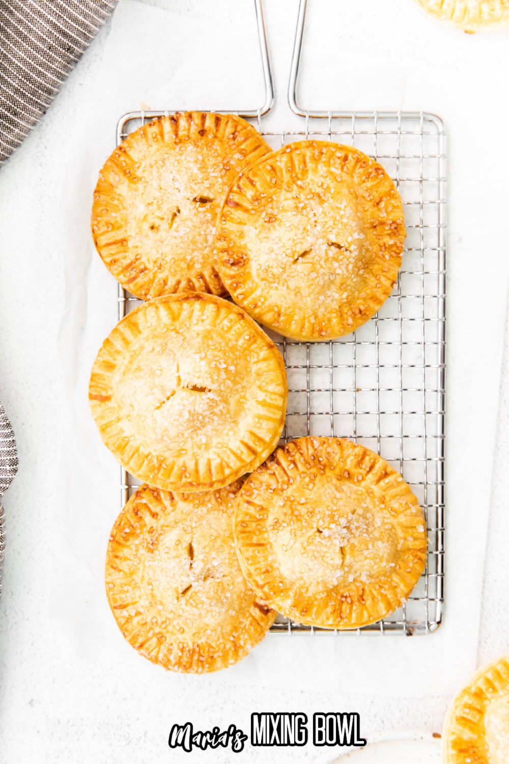 air fryer apple hand pies on a wire cooling rack