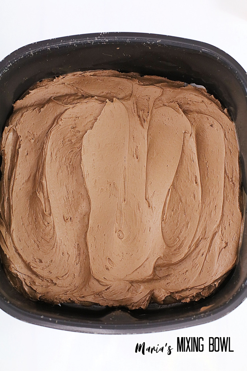 chocolate frosted dessert in an air fryer basket
