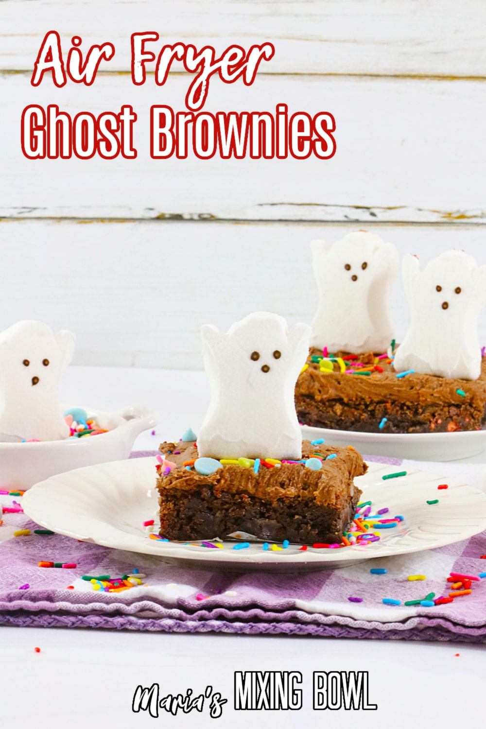 air fryer ghost brownie on a white plate with the name in text