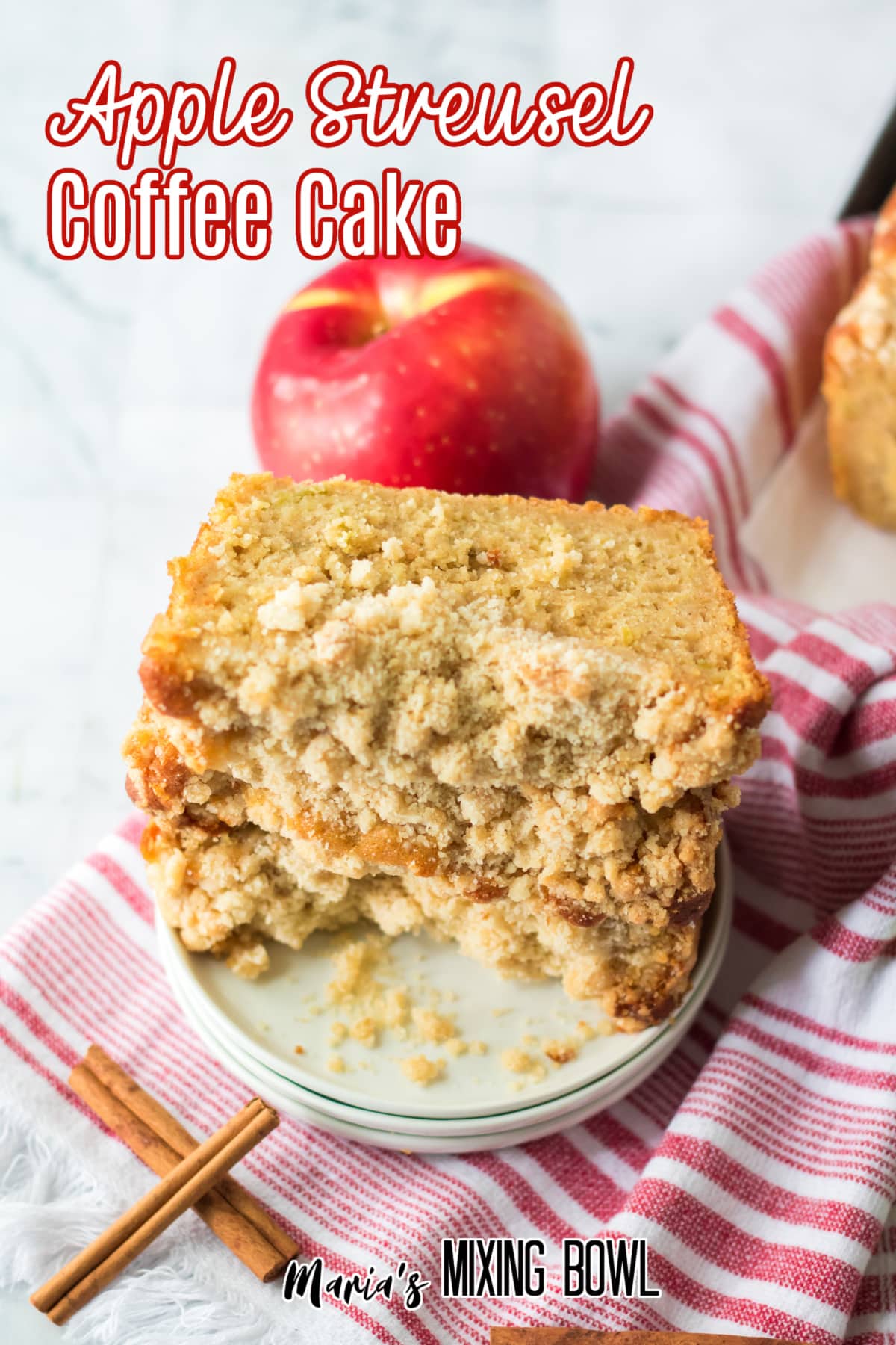 three slices of apple streusel cake on a small off white plate