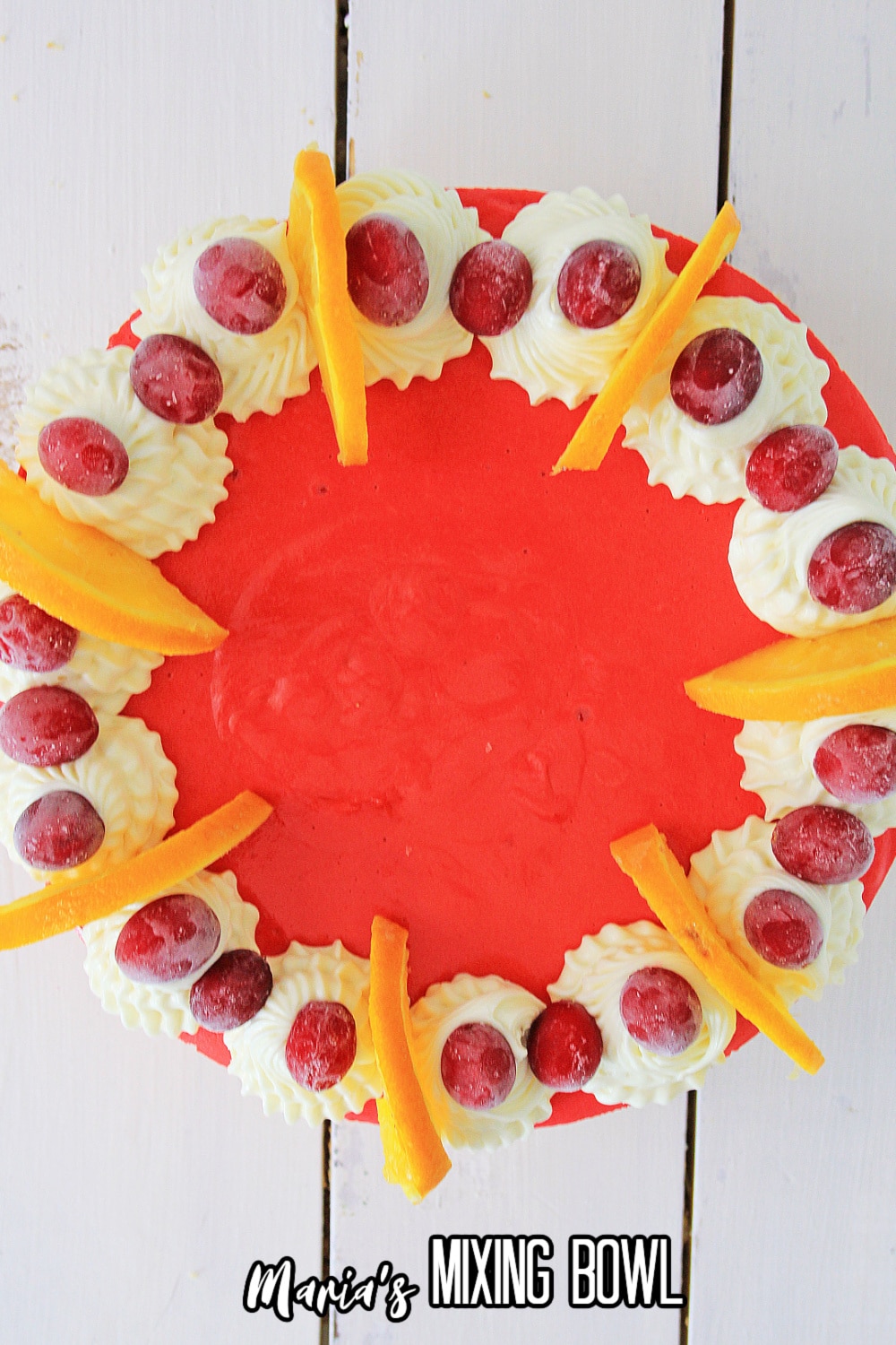 birds eye image of a whole cranberry orange cheesecake