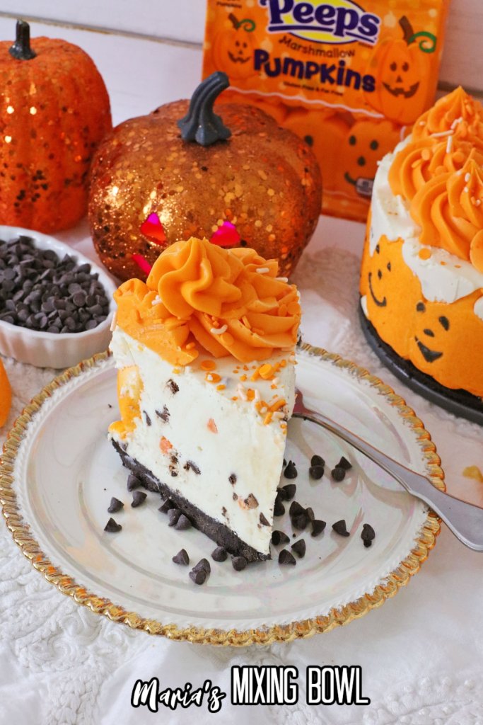 slice of halloween pumpkin cheesecake on a white plate with good trim