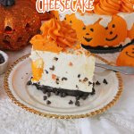 slice of halloween pumpkin cheesecake on a white plate with good trim