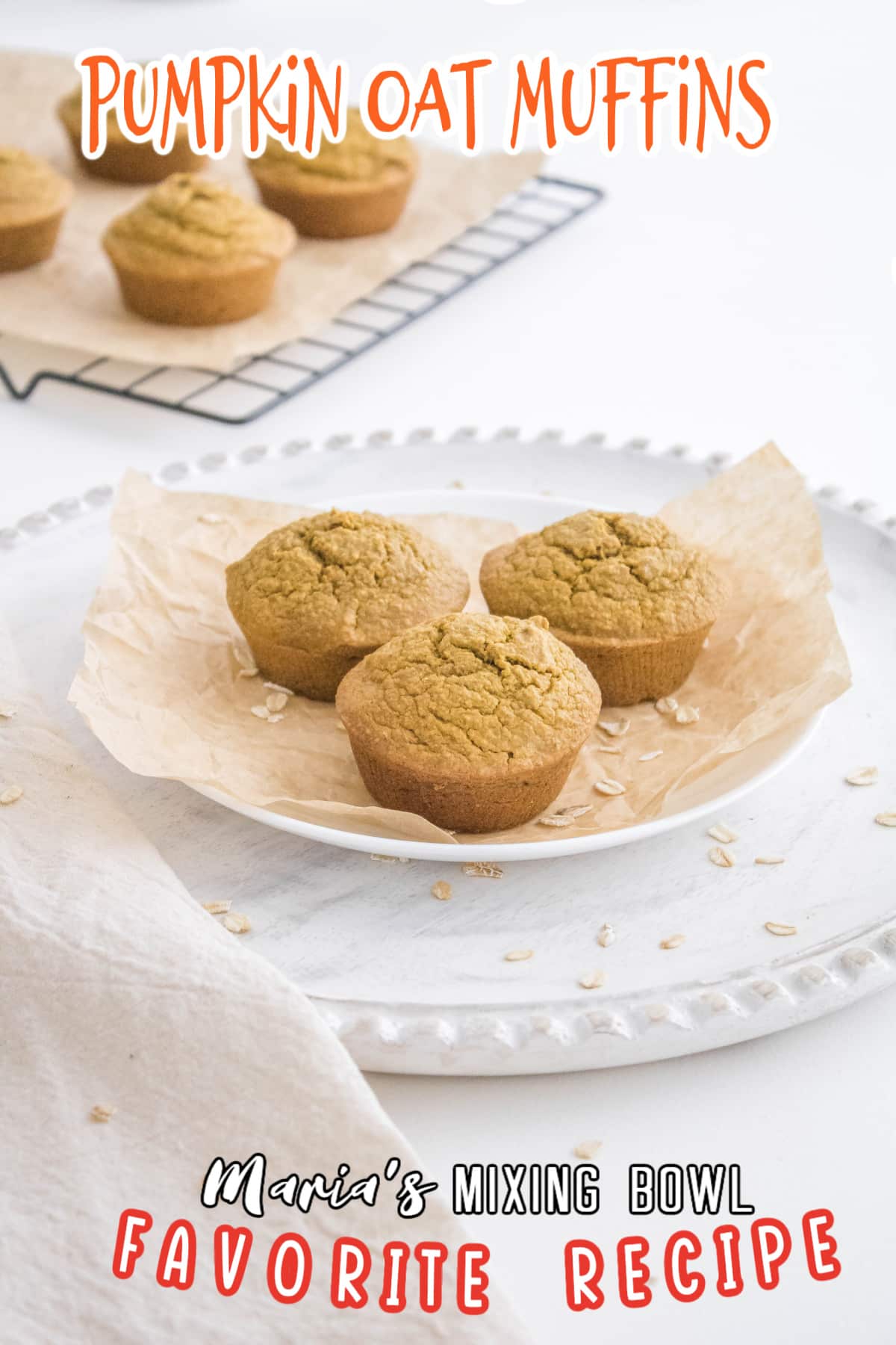 three pumpkin oat muffins on a white plate