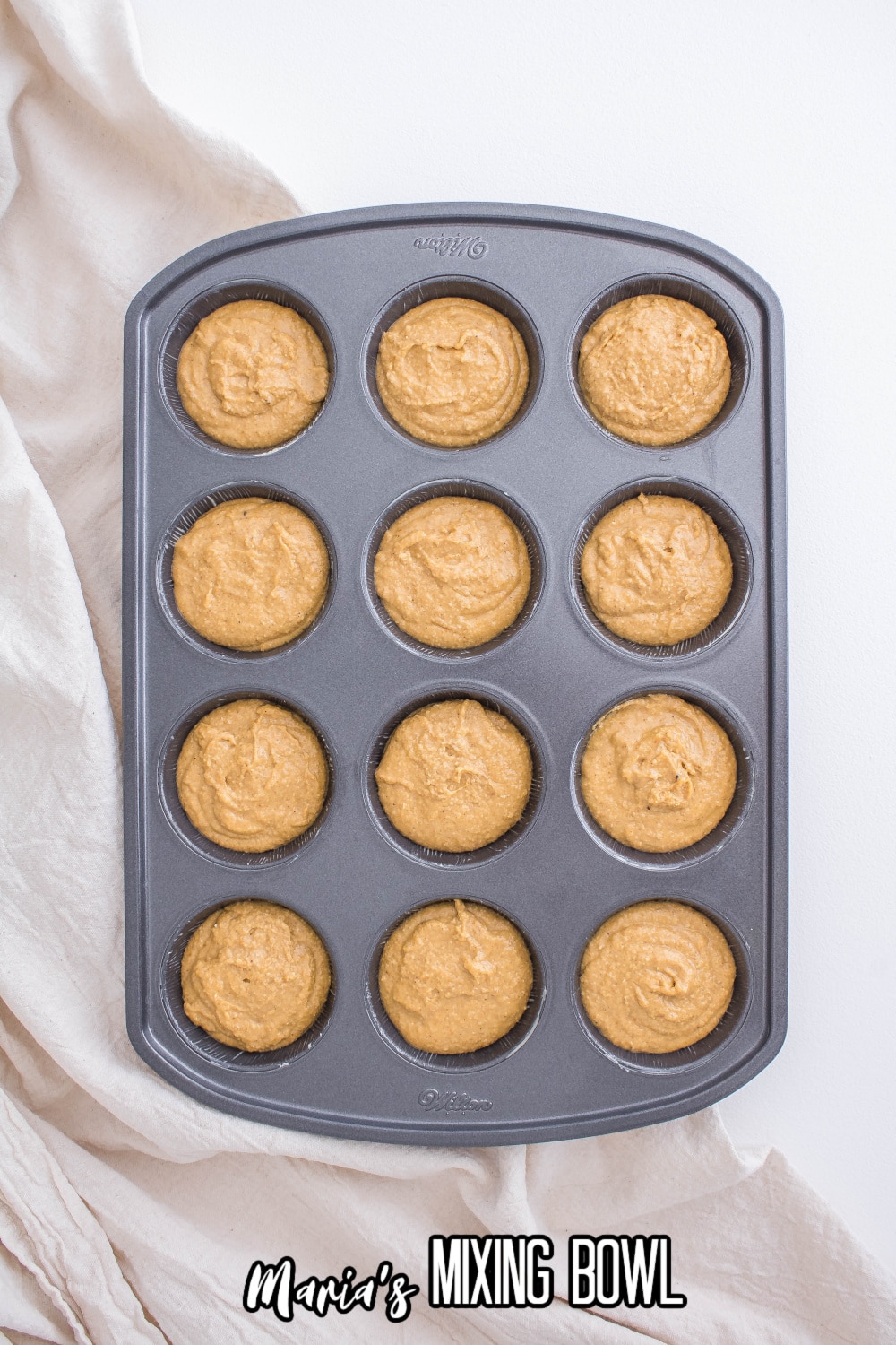 batter in a cupcake pan ready for the oven