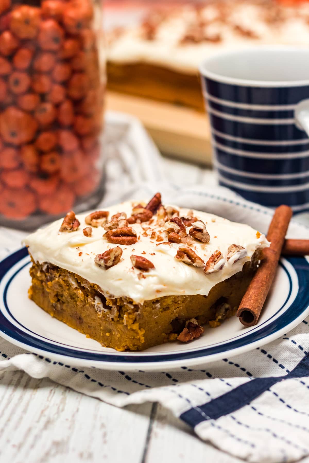 pumpkin pecan bar on a white and blue plate