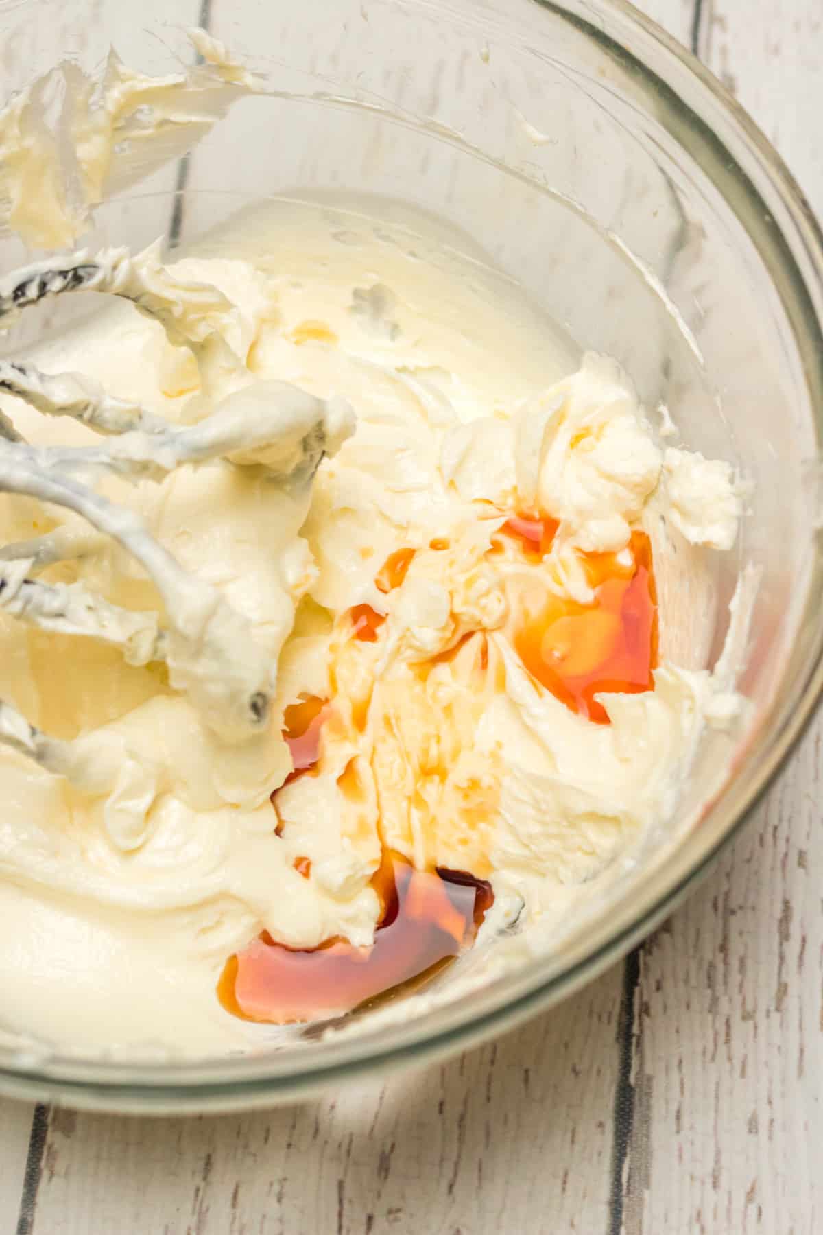 butter, cream cheese and vanilla in a glass bowl