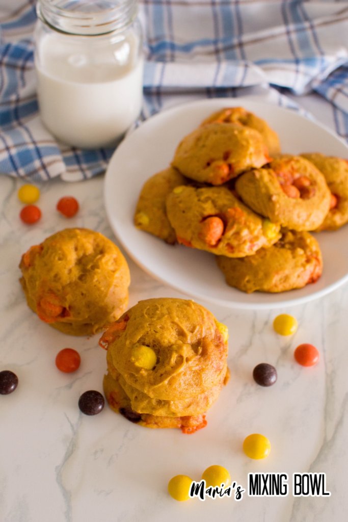 pumpkin reese's pieces cookies on a marble counter