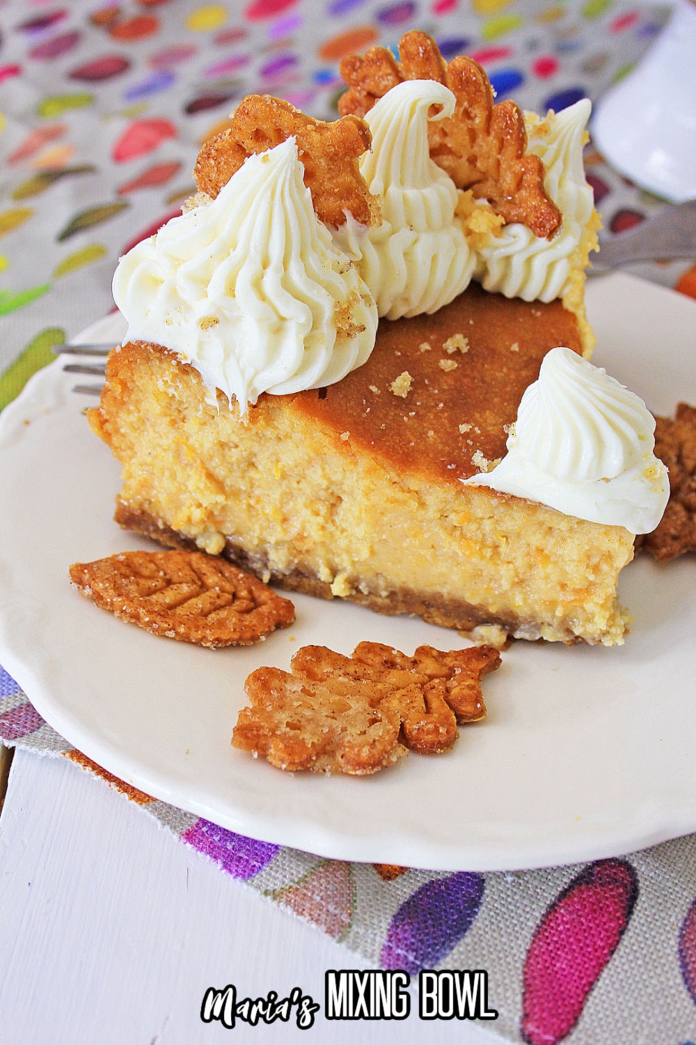 slice of sweet potato cheeecake with pie crusts leaves on the plate