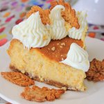 slice of sweet potato cheeecake with pie crusts leaves on the plate with the name in text for pinterest