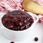 small white bowl of slow cooker cranberry sauce