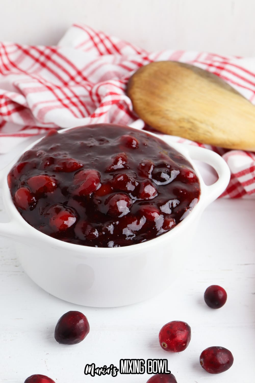 small white bowl of slow cooker cranberry sauce