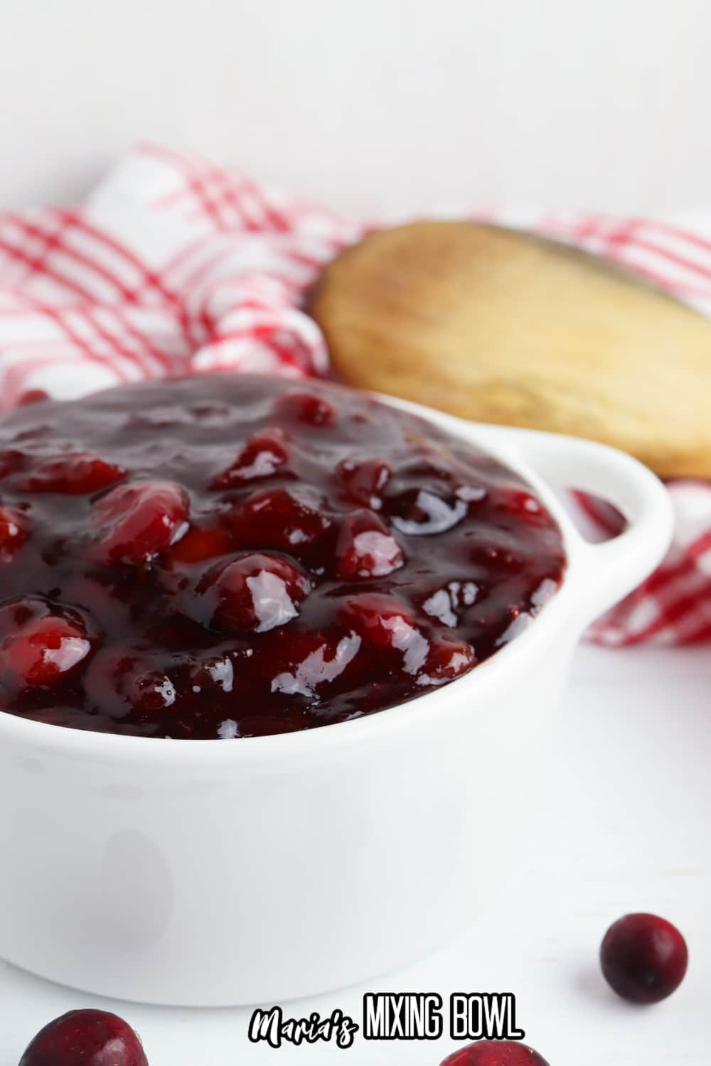 small white bowl of slow cooker cranberry sauce