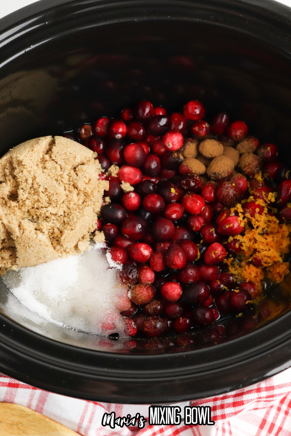 cranberries. and sugar in a slow cooker liner