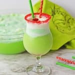 boozy grinch punch with a cherry on top