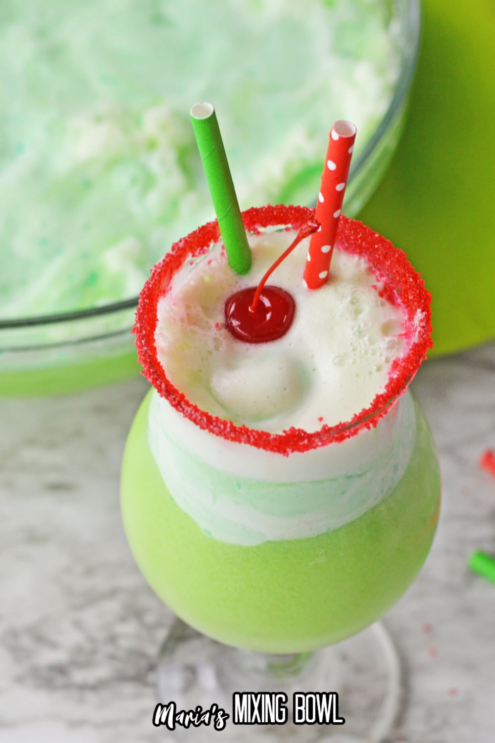 boozy grinch punch with a cherry on top