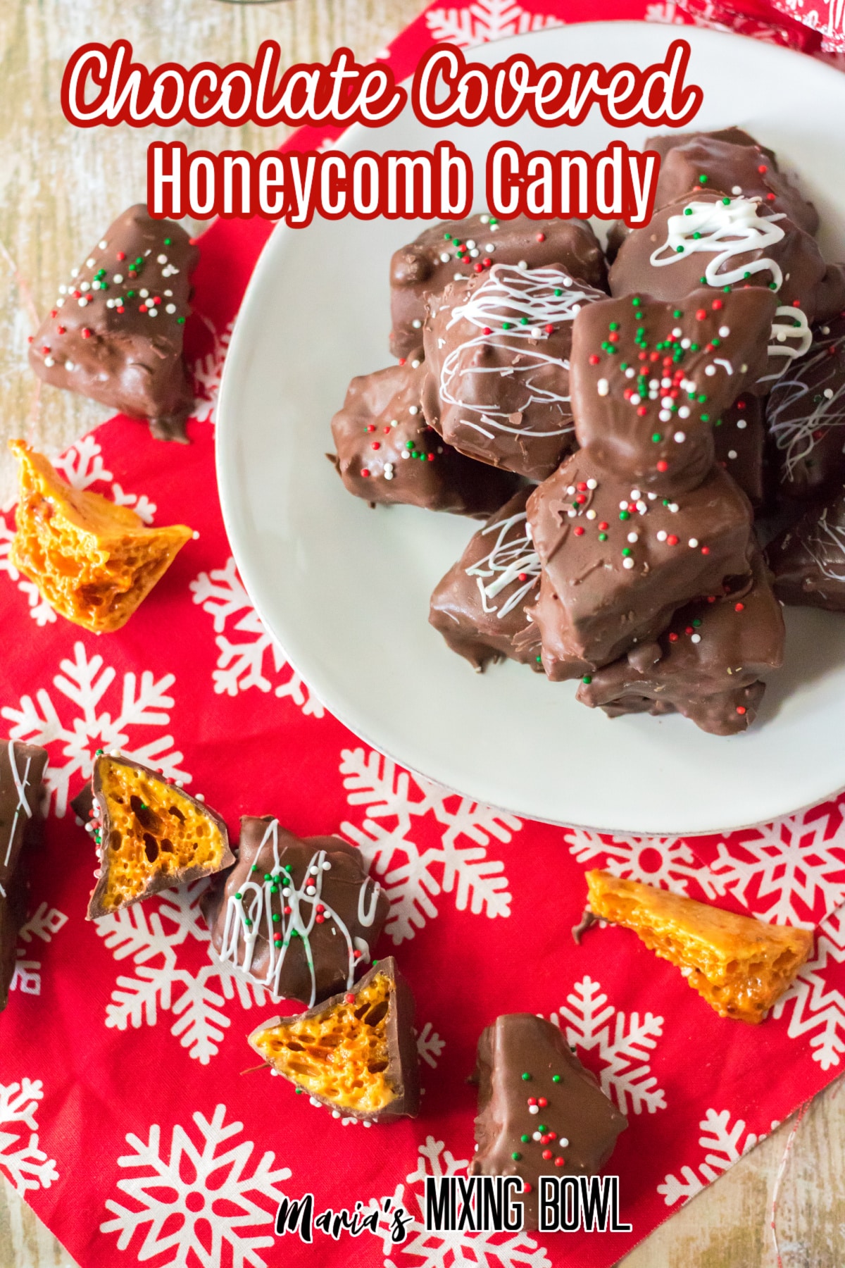 chocolate covered honeycomb brittle stacked on a white plate