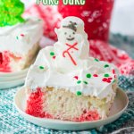 slice of christmas poke cake on small white plate