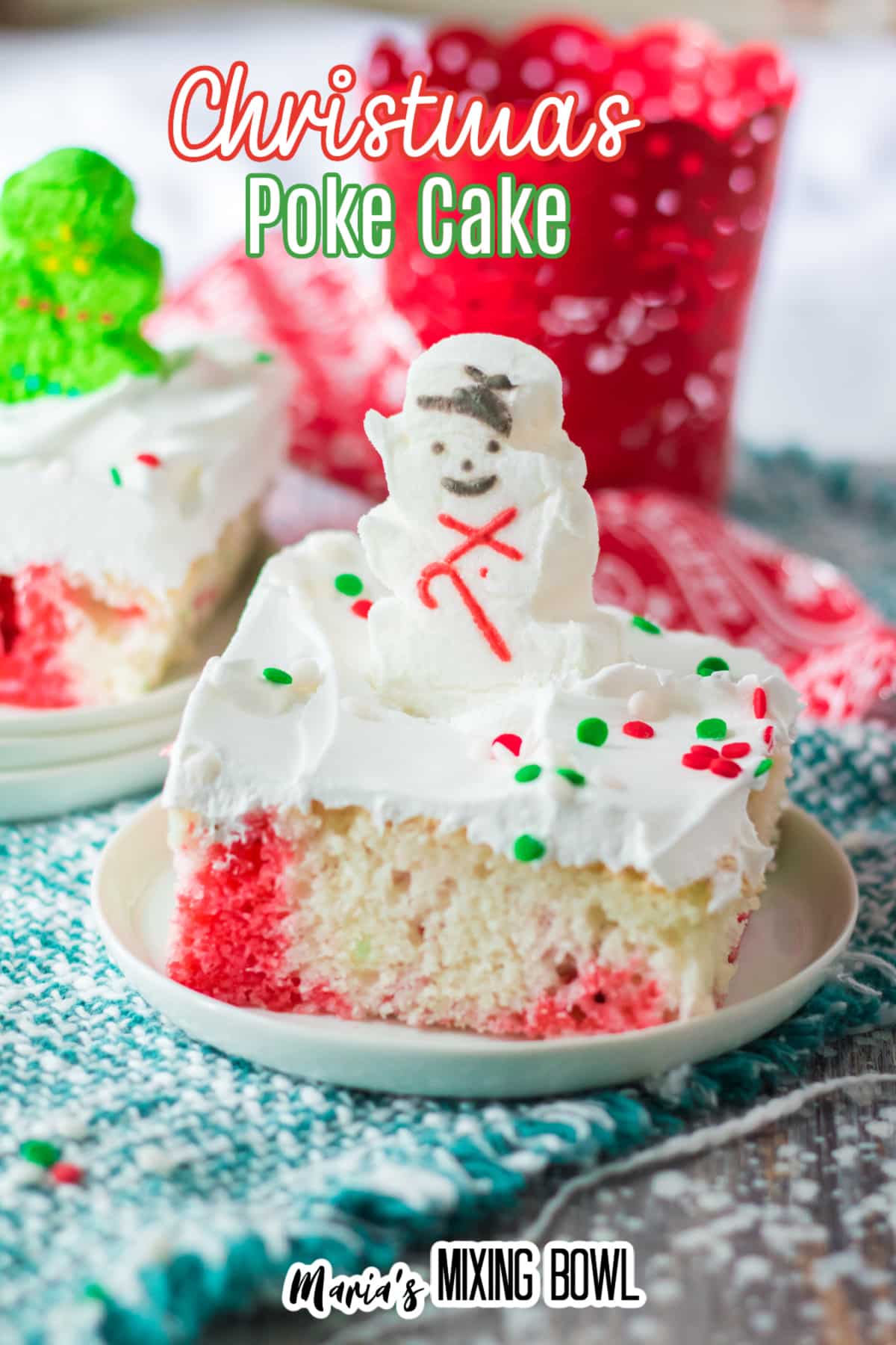 slice of christmas poke cake on small white plate
