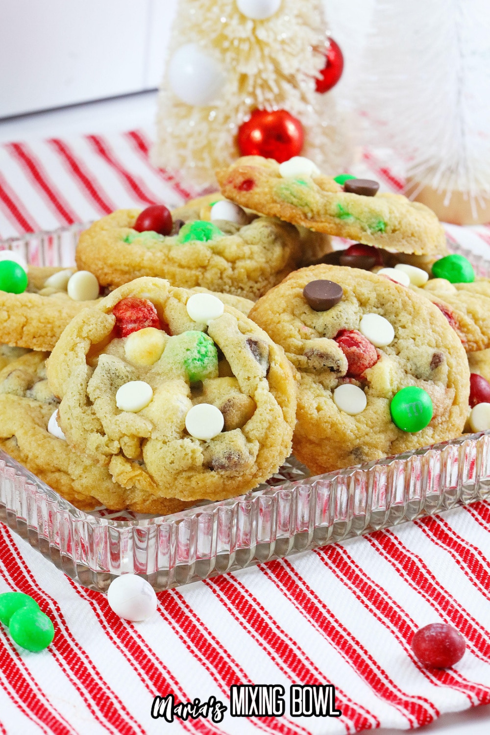 christmas toll house cookies stacked on a glass plate