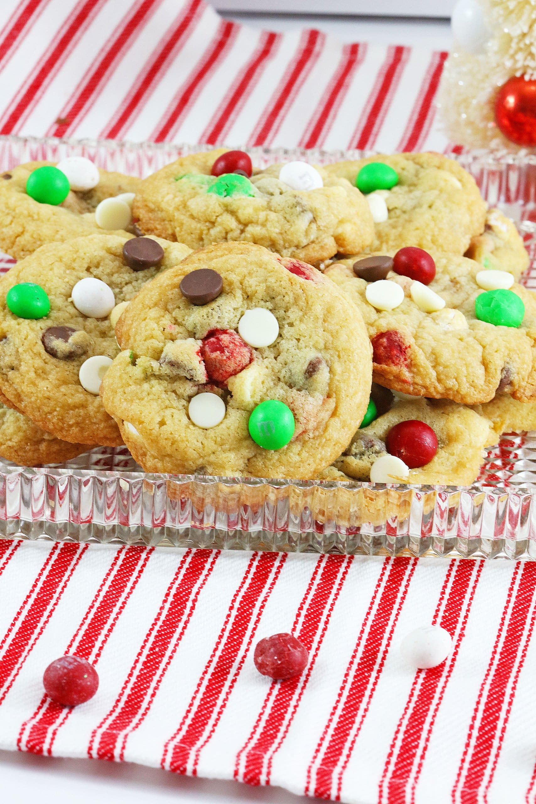 christmas toll house cookies stacked on a glass plate
