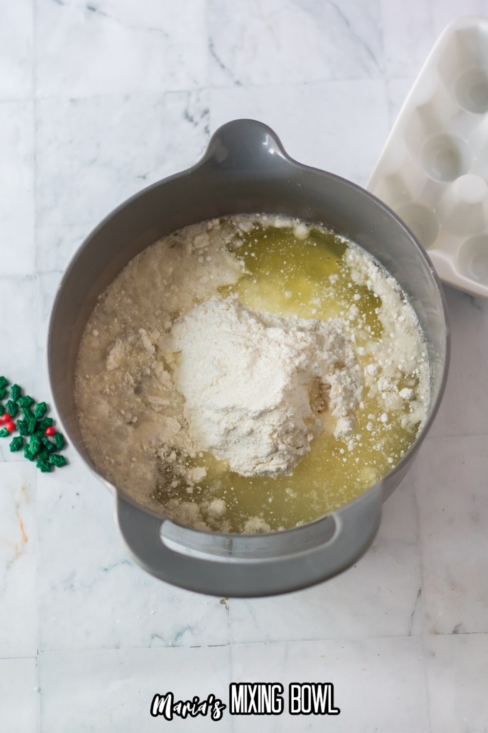 batter, oil and water in a stainless steel mixing bowl