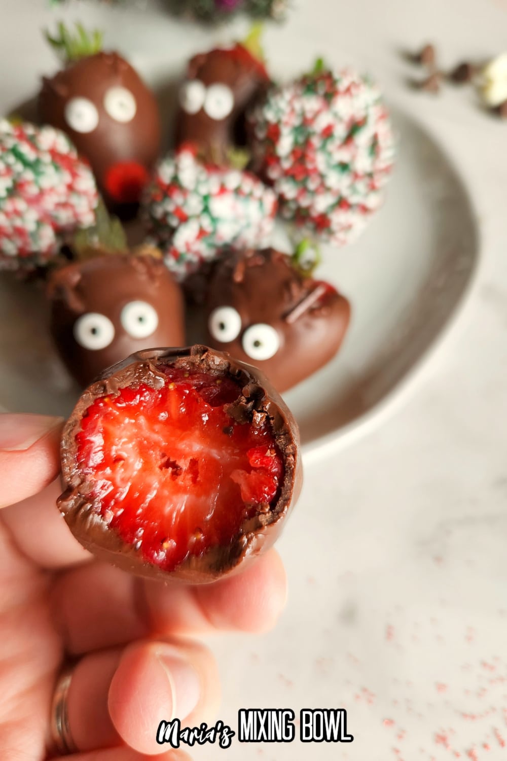chooclate covered strawberry biten in half