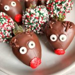 christmas chocolate covered strawberries on a white plate with the name in text for pinterst