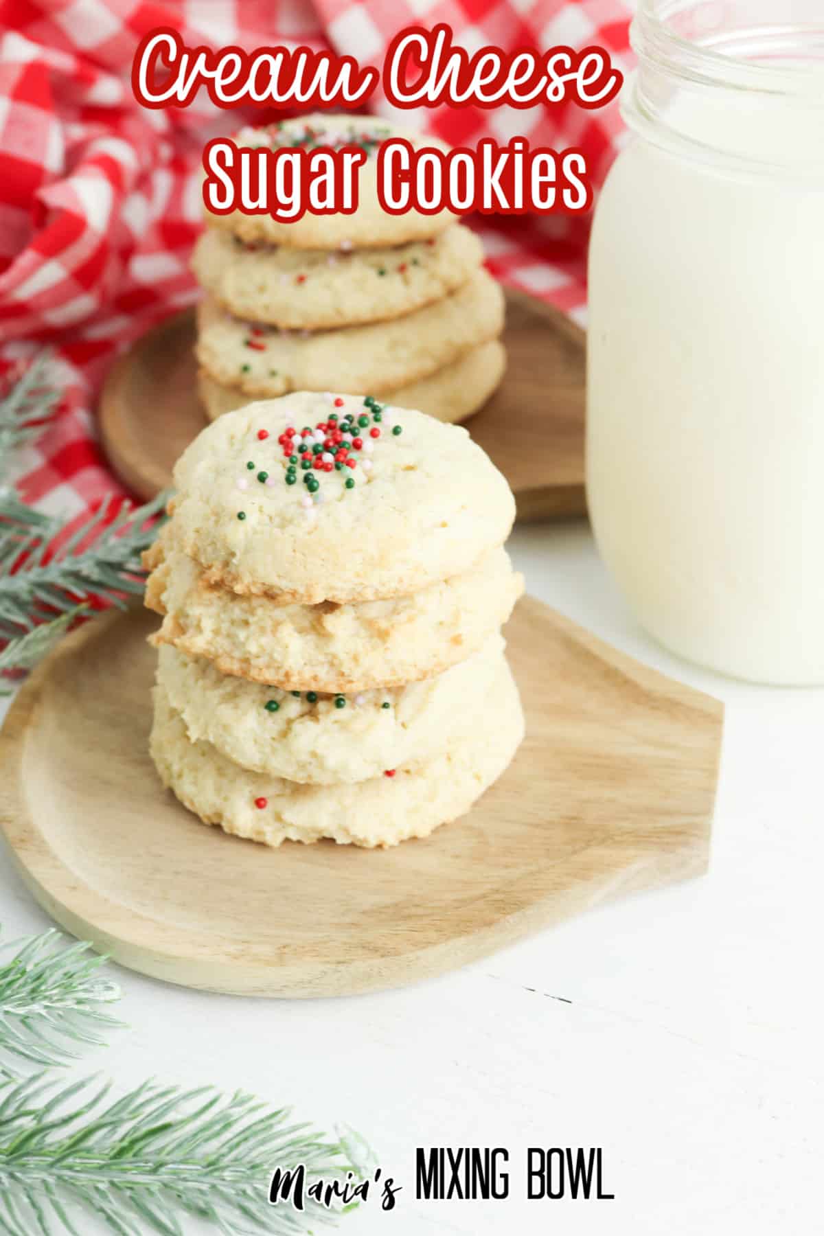 four cream cheese sugar cookies on a wooden cutting board with the name in text