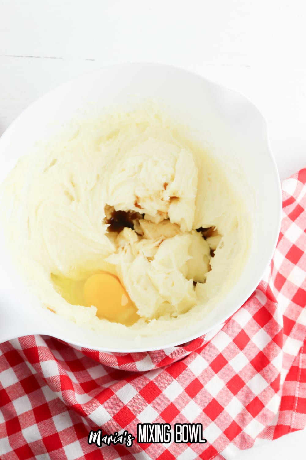 butter, eggs, and vanilla in a white mixing bowl