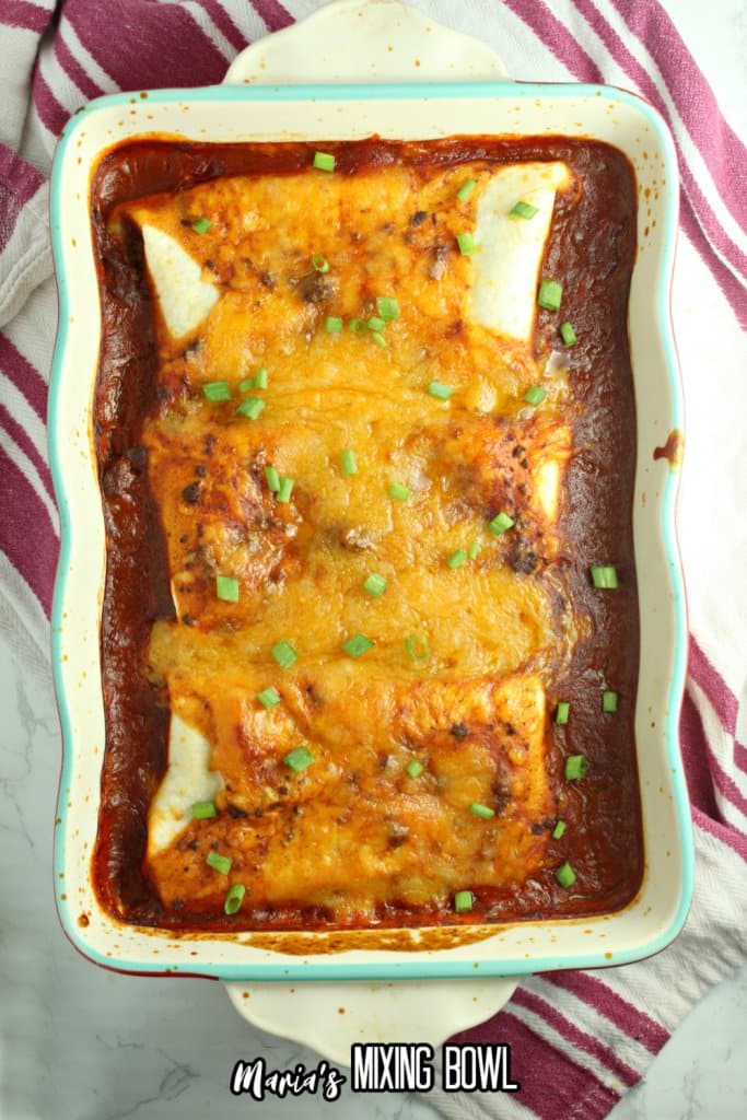 easy wet burritos in a cereamic casserole dish