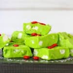 grinch fudge stacked in a pyramid on a wooden background